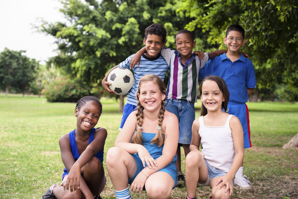 Children at summer camp playing outdoors